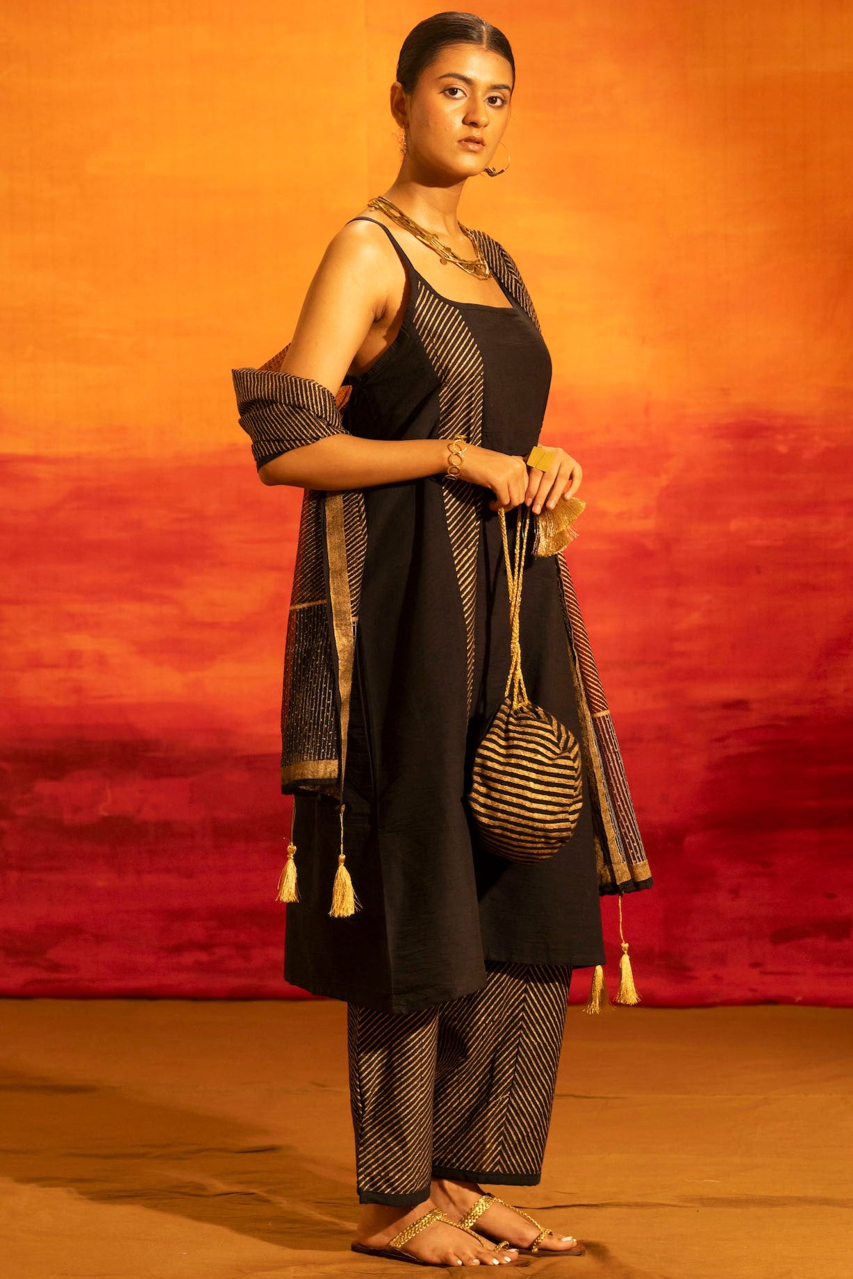 Illume Stria Black and Gold Potli