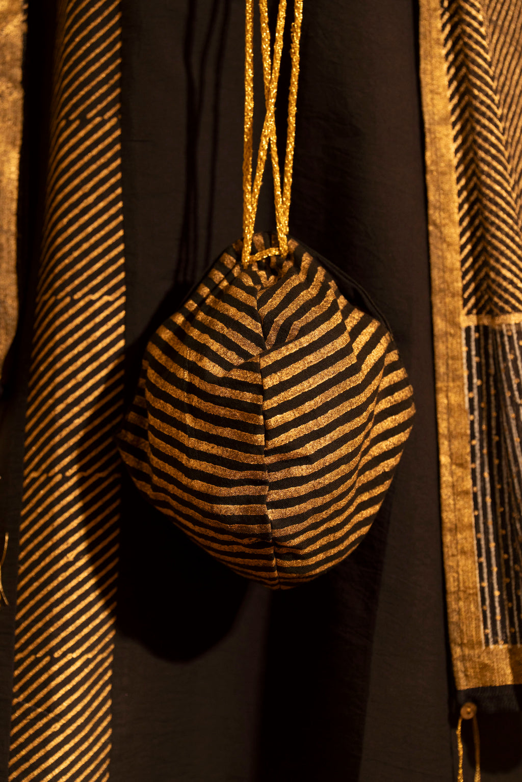 Illume Stria Black and Gold Potli