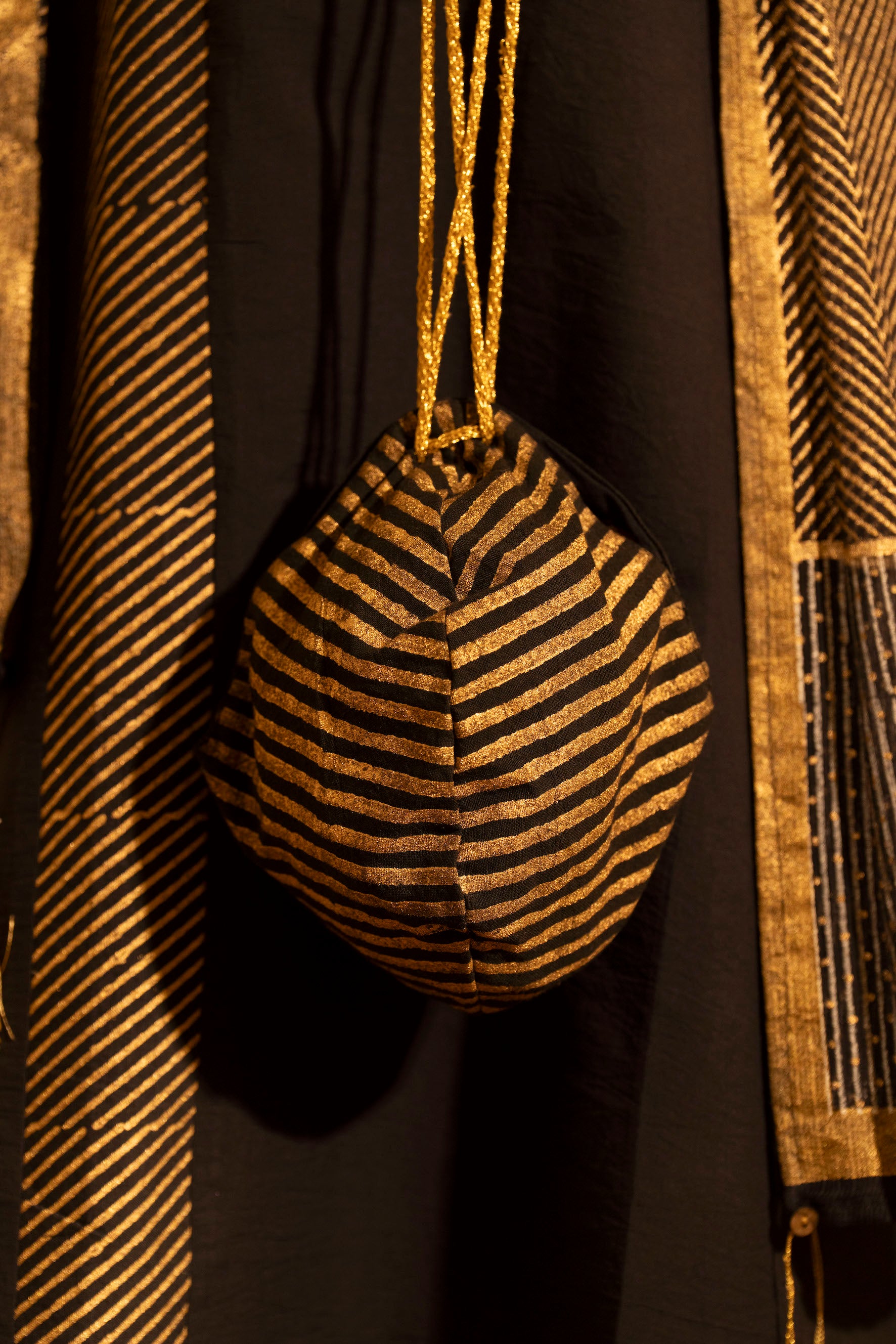 Illume Stria Black and Gold Potli